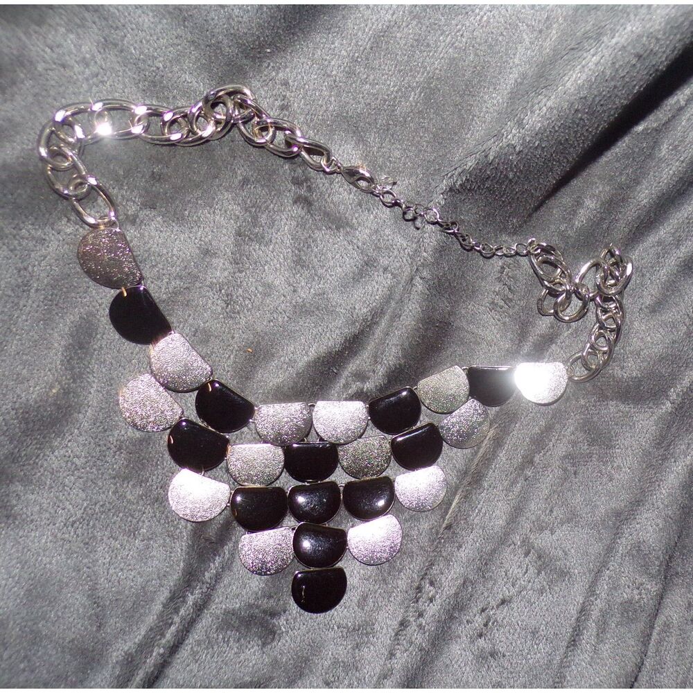 silver and black metal bib necklace